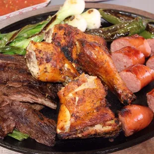 a plate of meat and vegetables