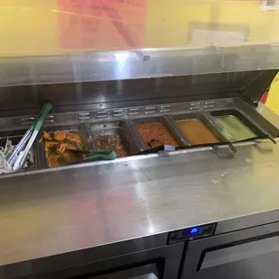 Salsa bar Beware the orange one is hot I think  it's habanero salsa, green salsa tasted good