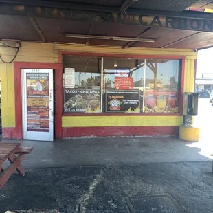 Outside of building some seating in the side and directly in front.