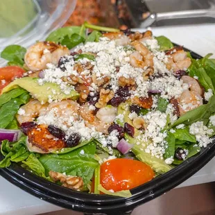 Walnut &amp; Spinach Salad , avocado, walnuts, cranberries, tomatoes, feta cheese, and red onions with house dressing