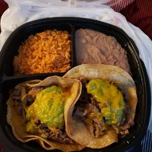 2 Carne Asada Tacos with guacamole and cheese only. Refried beans and rice.