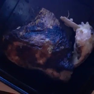 a piece of meat in a plastic container