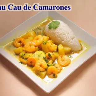 a plate of food with rice and shrimp