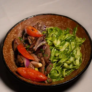 Tallarin Verde.
Our famous pesto fettucine tossed in spinach basil. Served with your choice of protein.