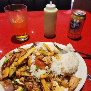 a plate of food with rice and chicken