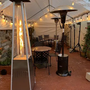 a patio with a fire pit