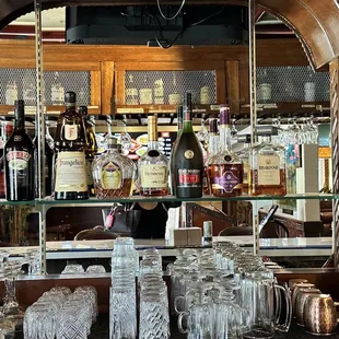 a bar filled with bottles and glasses