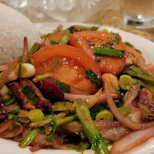 a plate of food with rice and vegetables