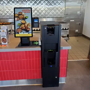 Kiosk that accepts cash for self serve.