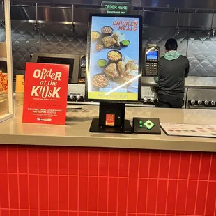 a person ordering food at a counter