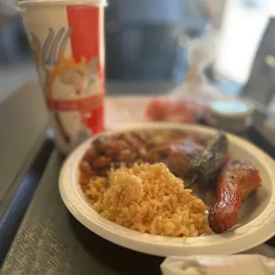Two piece chicken meal with Charro beans and rice.