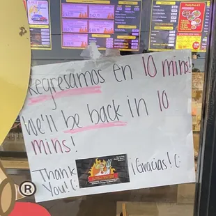 a sign in the window of a restaurant