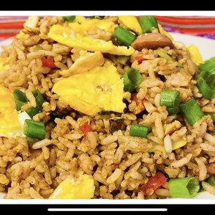 a plate of fried rice with eggs