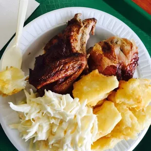 Half chicken with yuca and cole slaw.