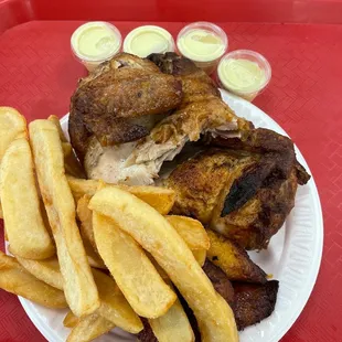 Half Chicken (that comes with 2 sides) fries, plantains.