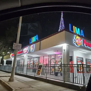 Outside with christmas tree. Cool lit name  signs