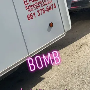 a food truck parked on the side of the road