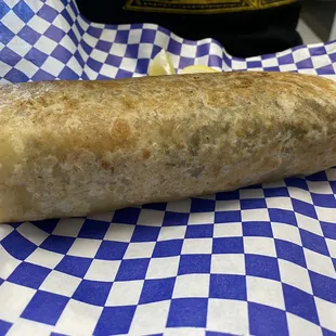 Asada burrito with all the works! Make sure to try a different sauce with every bite! You won't regret it