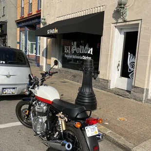a motorcycle parked in front of a building