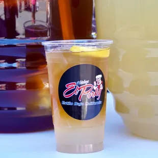 a pitcher of lemonade and a glass of lemonade