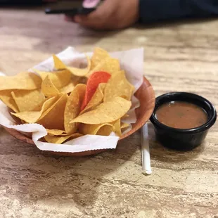 Salsa was warm and chips were not heavily salted.
