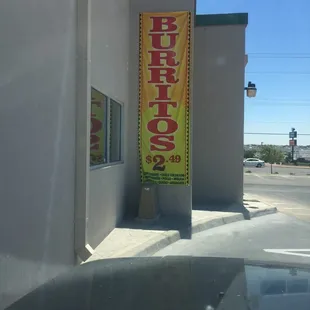a burrito sign on the side of a building