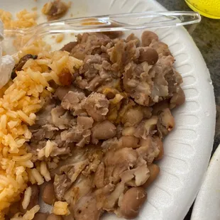 a plate of rice and meat