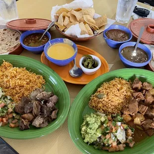 Left: Carnitas Plate. Right: Carne Guisada Plate.