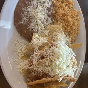 Chicken taco with cheese with beans and rice no flavor or taste at all