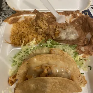 2 crunchy chicken tacos only cheese with rice and beans