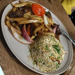 Lomo Salatado Beef sautéed with French fries, tomatoes, onions, and cilantro with a side of white rice or upgrade to fried rice