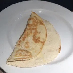 This is how my sons cheese quesadilla came out...  it was the icing on the cake to the absolutely horrific service.