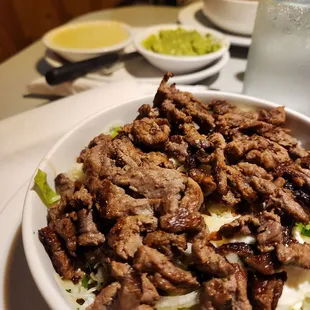 a bowl of beef and rice