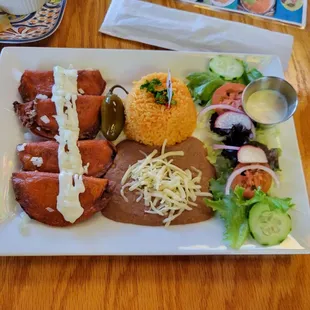 Enchilada Potosinas with rice, beans, and fresh salad. House ranch is amazingly good, and I don&apos;t usually care for ranch dressing.