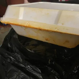 Handed bag to me through drive thru with food box almost sideways