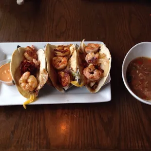 three tacos and a bowl of soup