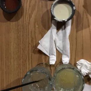 a table with drinks and condiments
