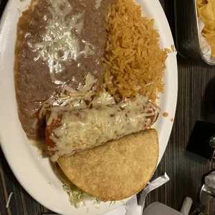Hard beef taco, beef enchiladas, refried beans and rice
