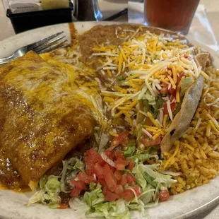Combination #1 - crispy taco, burrito, enchiladas with refried beans and rice