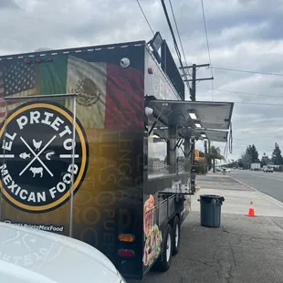 a food truck parked on the side of the road