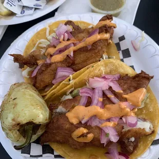 a plate of fish tacos