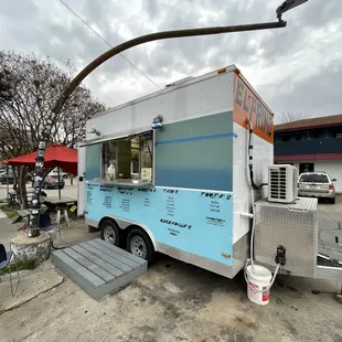 a food truck parked on the side of the road