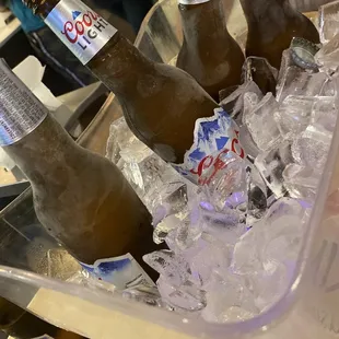 bottles of beer in ice