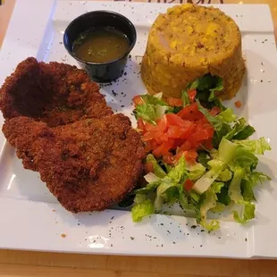 Spanish food mofongo with breaded steak