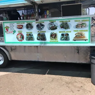 a food truck with menus on it