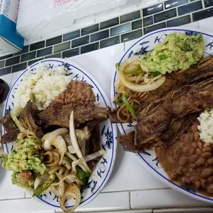 three plates of food on a counter