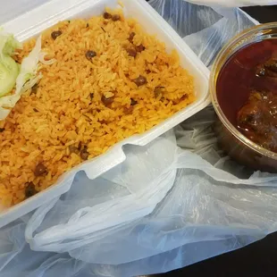 Yum yum yum, yellow rice with beans. Little pickled side salad. Ribs are very good, fall off the bone.