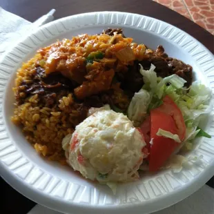 Yellow rice with bacalo and beef stew
