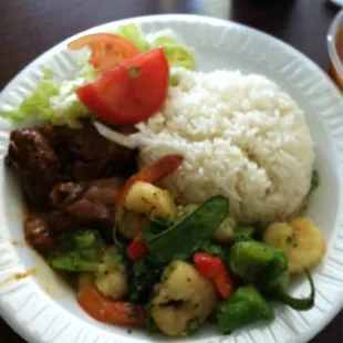 White rice with chicken stew and shrimp salad