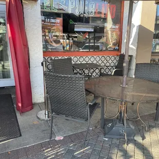 a table and chairs outside a restaurant